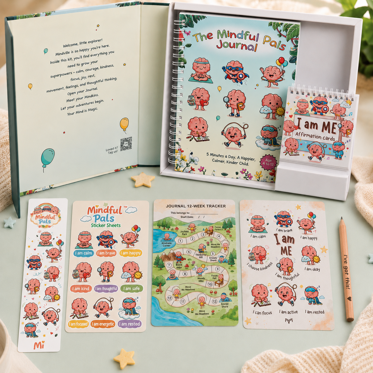 Mindful Pals journal set with stickers, tracker, and cards on a light surface.